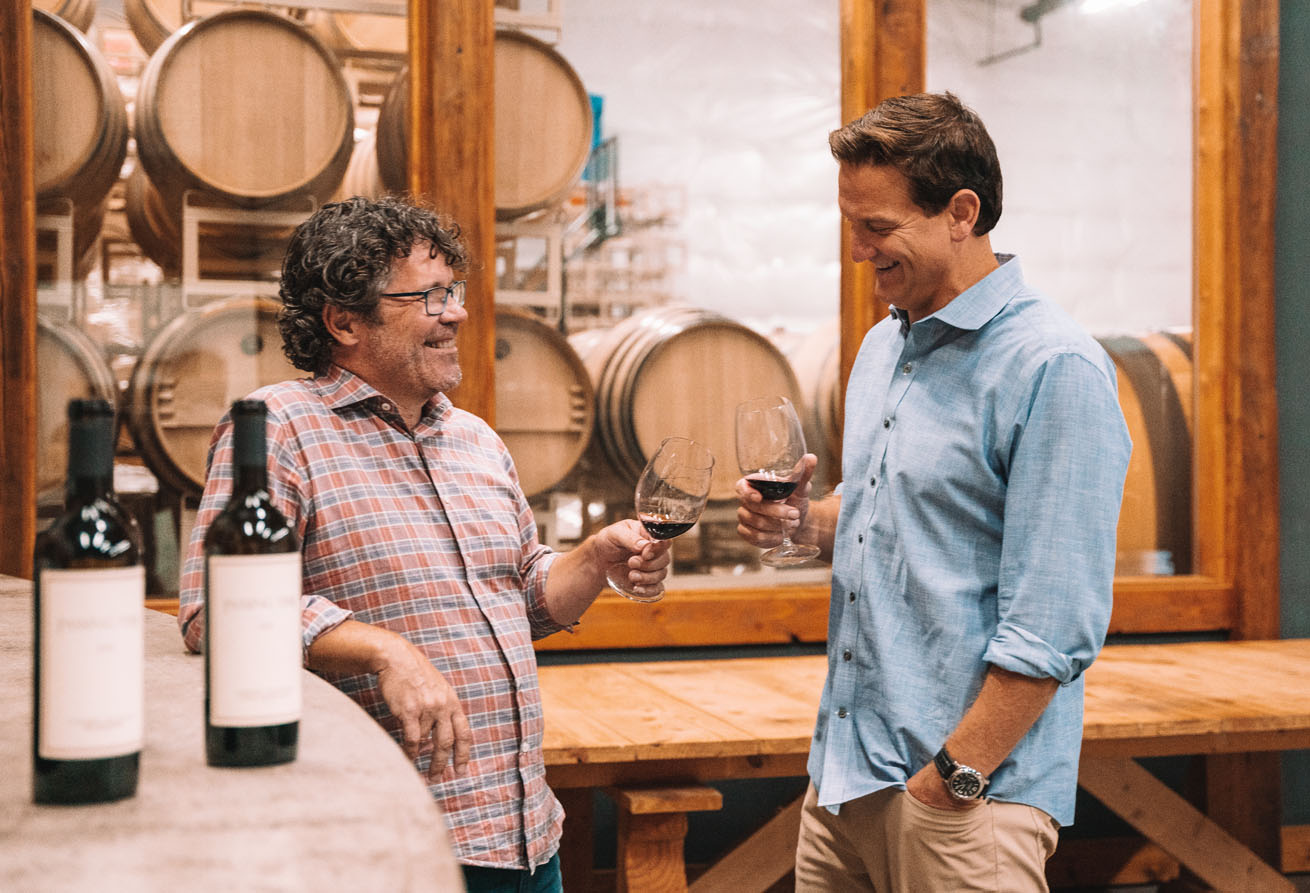 Storied winemaker, Chris Peterson, and Damon Huard "Passing Time" with a glass of wine