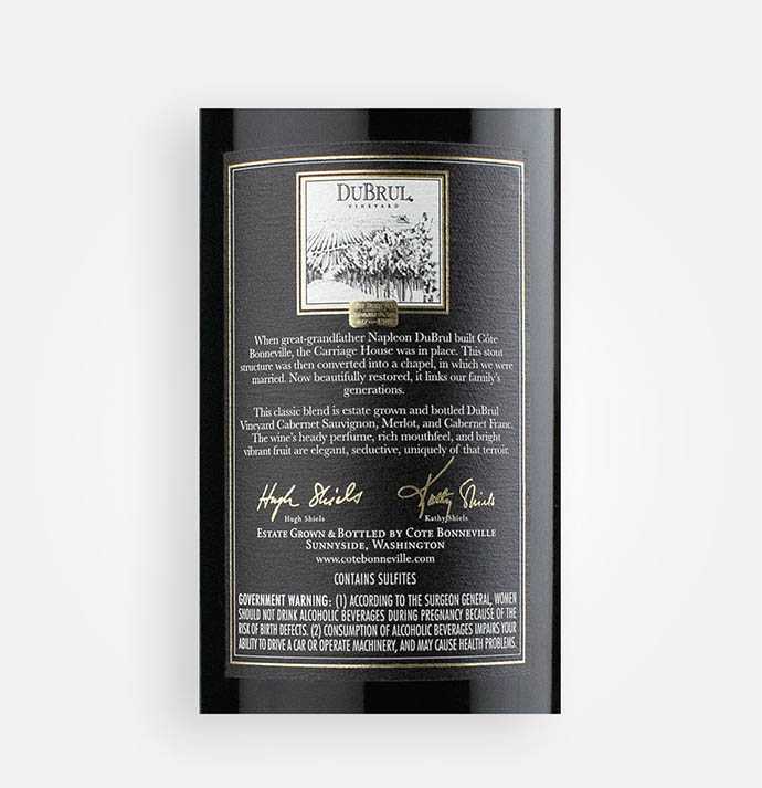 Back label close-up of Côte Bonneville 2015 Carriage House Washington red wine from DeBrul Vineyard