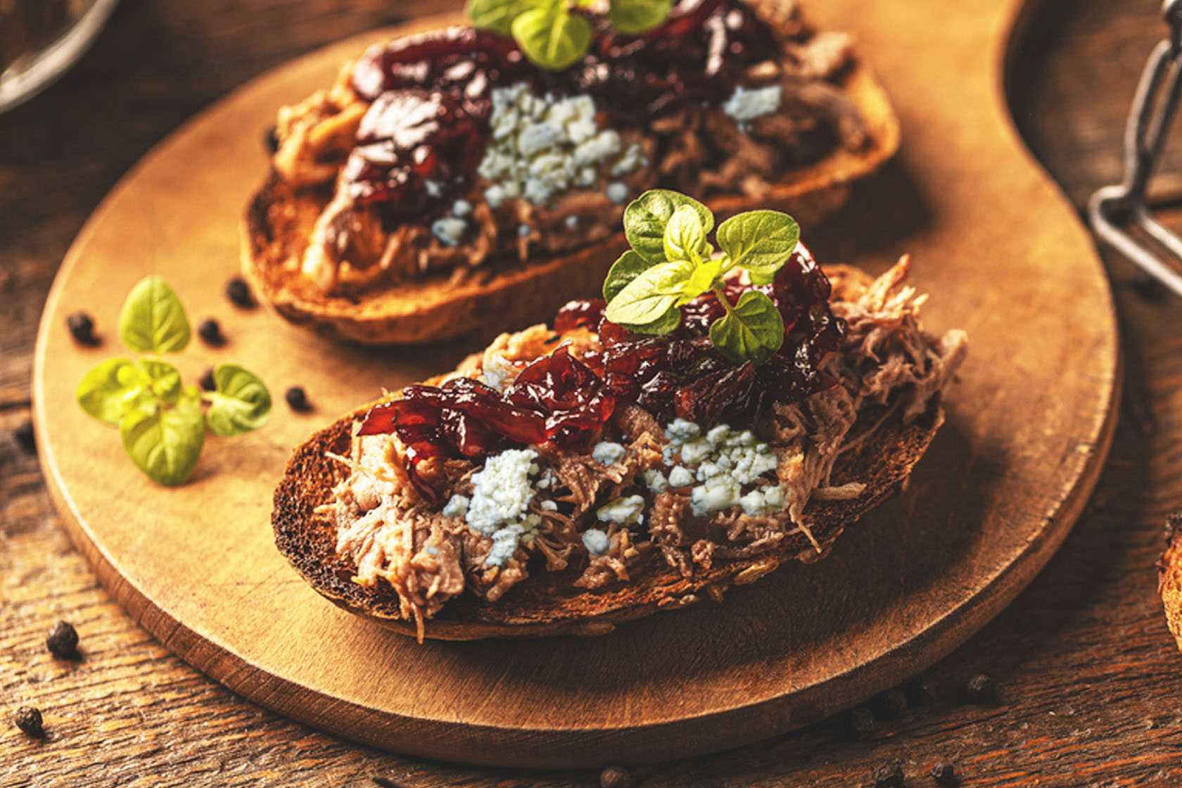 Duck confit, fig jam and smoky blue cheese on sliced baguette